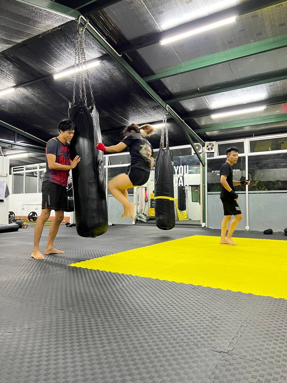 Fighters training on the punching bags at the original Wasp MMA gym